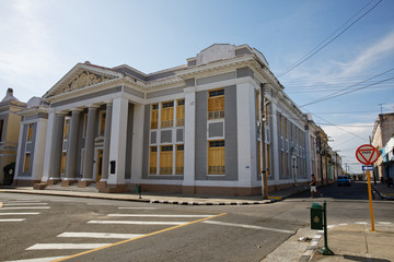 Cienfuegos, Cuba - July 26, 2018: City Hall in Jose Marti Park, the UNESCO World Heritage main square of Cienfuegos, Cuba