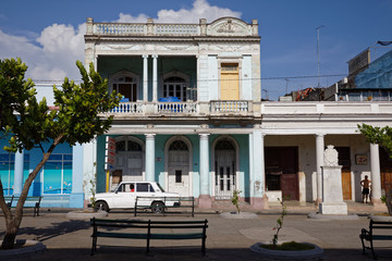 Cienfuegos, Cuba - July 26, 2018: Traditional colonial style colored buildings located on main street Paseo el Prado in Cienfuegos, Cuba