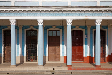 Cienfuegos, Cuba - July 26, 2018: Traditional colonial style colored buildings located on main street Paseo el Prado in Cienfuegos, Cuba
