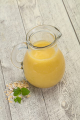 Dietary vegetarian oats milk over wooden