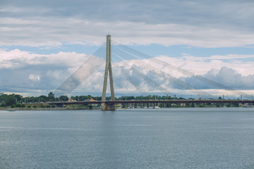 City Riga, Latvia Republic. Urban city cable bridge and river. Old metal constructions.  July 4. 2019