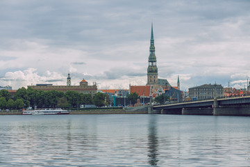 Obraz premium City Riga, Latvia Republic. View to old city and river Daugava. Urban city in summer. July 4. 2019 Travel photo.