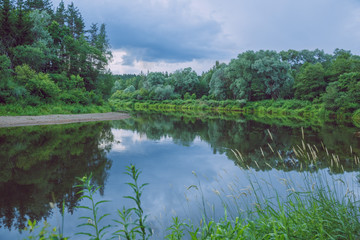 City Cesis, Latvia Republic. Red rocks and river Gauja. Nature  and green trees in summer. July 4. 2019 Travel photo.