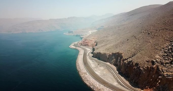 Coastal road and seaside in Musandam Governorate of Oman aerial footage