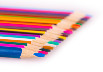 The number of colored pencils on a white background