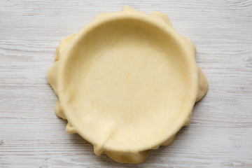 Raw dough for preparation apple pie, overhead view. Flat lay, from above, top view. Close-up.