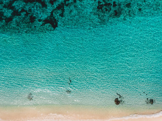 Tropical beach with blue ocean, aerial view