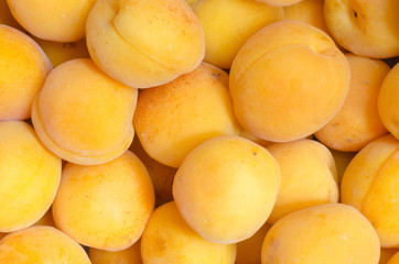 Fototapeta na wymiar Ripe and delicious apricots background