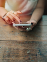 Women hands using smartphone.