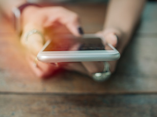 Women hands using smartphone.