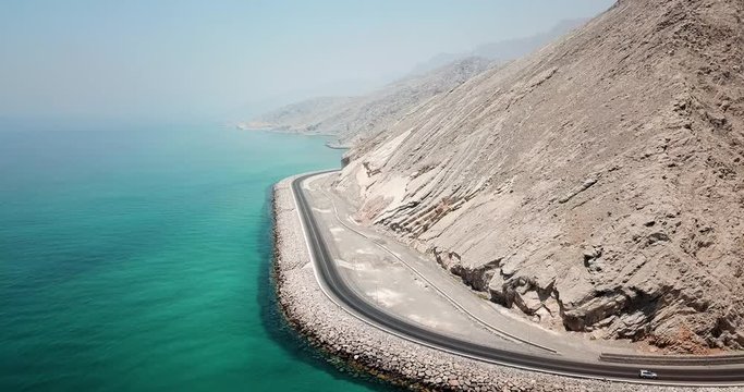 Coastal road and seaside in Musandam Governorate of Oman aerial footage