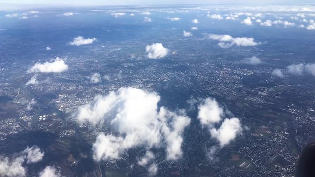 view from an airplane flying above city, landscape  in Europe
