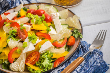 Salad with cheese and fresh vegetables.