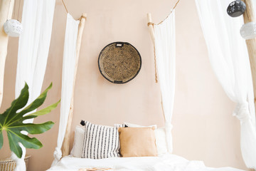 interior room made in white and beige colors in the style of boho
