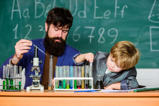 Everyone Successful Everyday. Chemistry and physics biology. Wisdom. Back to school. small boy with teacher man. Flask in scientist hand with Test tubes. son and father at school