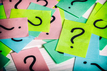 Just a lot of question marks on colored papers