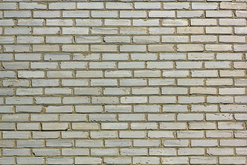 Weathered texture of stained old white brick wall background, grungy rusty blocks of stone-work technology
