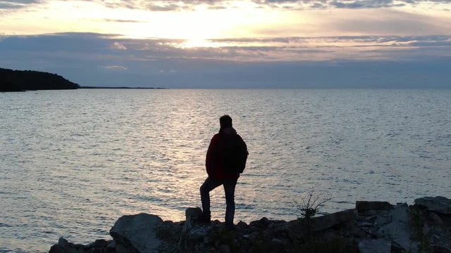 A man by the sea. Shot on drone