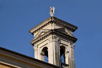Detail of the bell tower of the parish church of the village of Palazzolo - Italy