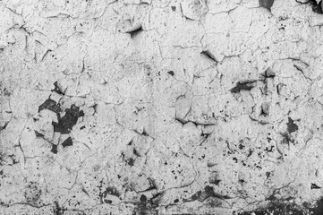 Old cracked paint on the concrete wall. Peeling paint on wall texture. Pattern of rustic blue grunge material