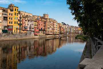 Fototapeta na wymiar Girona main landmark river houses reflection on a blue sunny day
