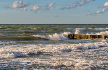 Breakwater struggling with large waves in windy weather
