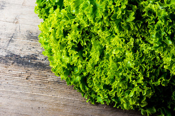 green salad on woodenbackground