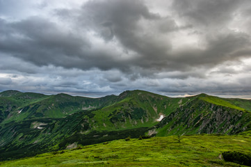 Fototapeta premium Cloudy day in the mountains in summer
