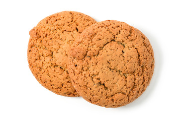 Homemade cookies. Two sweet cookie made from oatmeal flour. Tasty biscuit in high resolution closeup isolated on white background, top. Homemade bakery.