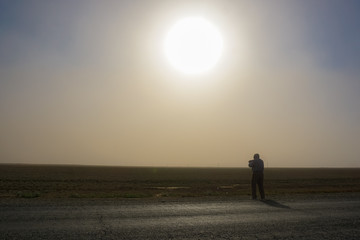 Dust storm on the road from Makhachkala to Elista. Sunlight obscured by dust, day turns into night