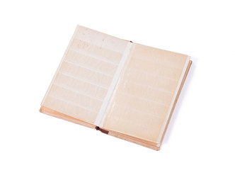 Closed old book for postage stamps isolated