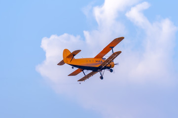 View on an old plane flying againtst the blue sky