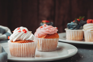 Group of cupcakes on dark background selective focus