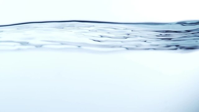 Super slow motion of splashing water isolated on white background. Filmed on high speed cinema camera, 1000 fps.