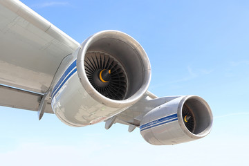 Airplane wing with two aircraft engines in flight