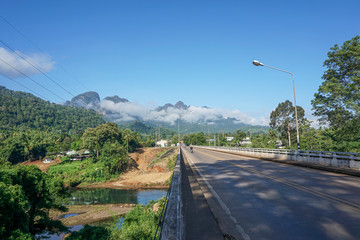 Fototapeta na wymiar The destination of the road is a foggy mountain road to Pilok Village, Kanchanaburi Province, Thailand.