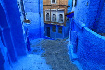 Blue street walls of the popular city of Morocco, Chefchaouen. Traditional moroccan architectural details.