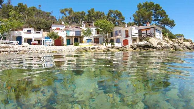 Spain typical fishermen houses on the seashore, Mediterranean sea, Costa Brava, Cala s'Alguer, Palamos, Catalonia