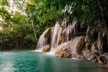 Clean green emerald water from the waterfall Surrounded by small trees - large trees,  green colour, Erawan waterfall, Kanchanaburi province, Thailand