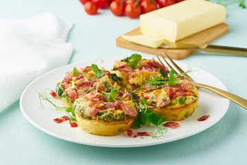 Egg muffin baked with bacon and tomato, ketogenic keto diet, pastel modern closeup
