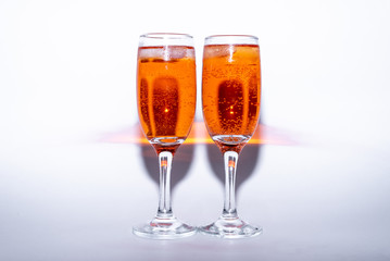 glass of sweet cocktail aperol Spritz with ice on white background