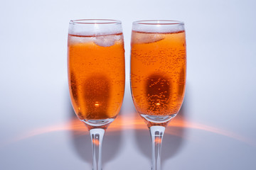 glass of sweet cocktail aperol Spritz with ice on white background