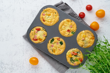 omelet with tomatoes and bacon, baked eggs with spinach and broccoli, top view, keto, ketogenic diet
