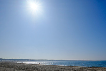 Beautiful Beach With Crystal Clear Blue Waters of The Sea Against Blue Sky on a summers day
