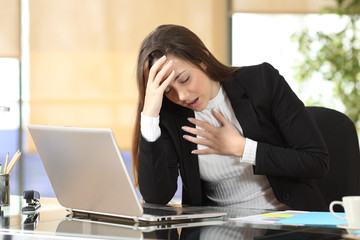 Worried businesswoman suffering an anxiety attack