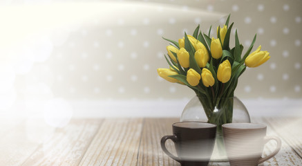  bouquet of yellow tulips in a vase on the floor