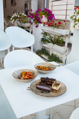 Vegan cafe table. Vegetarian food and desserts on the table.