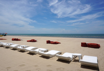 The beautiful beach with outdoor furniture on the sand with sky background