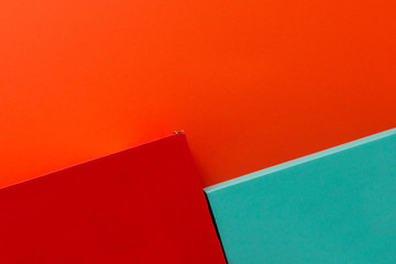 Green and red shoe boxes on orange background
