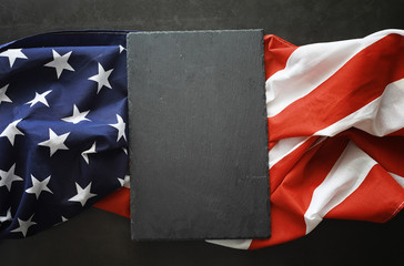 Fototapeta na wymiar American flag on a black background. Space for text.